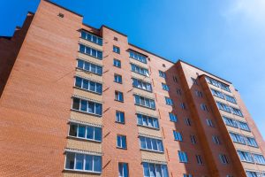 Modern and new apartment building. Multistoried, modern, new and stylish living block of flats. Real estate. New house. Newly built block of flats.